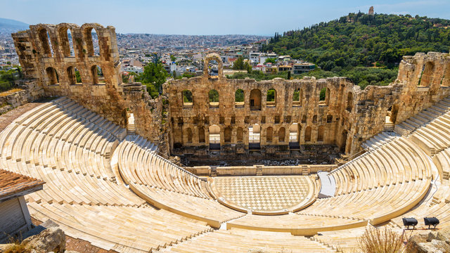Odeon of Herodes Atticus at Acropolis of Athens, Greece. It is one of top landmarks of Athens. Panoramic view of ancient theater overlooking Athens city.