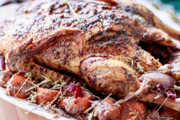 Obraz na płótnie Canvas Roasted whole duck. Cooked with carrots, onions and thyme with garnish of rice and gravy. Beautiful festive food