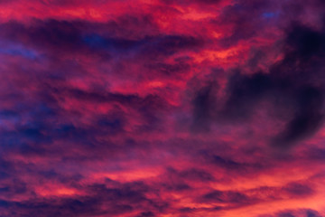 mysterious smoky fiery sky at sundown in summertime makes for an intense background - 318033153