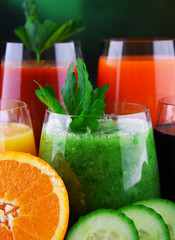 Glasses with fresh organic vegetable and fruit juices