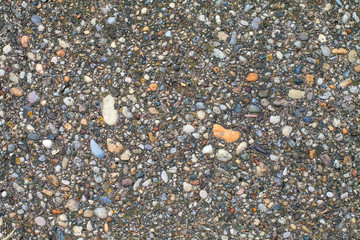 Homemade Exposed Aggregate Concrete. Beton with visible brash texture. Photographic pattern of dense ballast concrete. Gray rabblework bg image, top view. Strong concrete surface. Site concrete floor