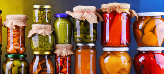 Jars with variety of pickled vegetables and fruits