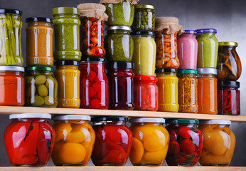 Jars with variety of pickled vegetables and fruits