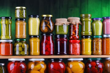 Jars with variety of pickled vegetables and fruits