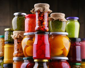 Jars with variety of pickled vegetables and fruits