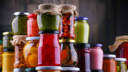 Jars with variety of pickled vegetables and fruits