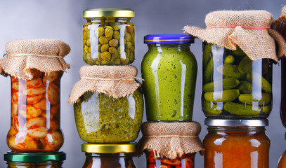 Jars with variety of pickled vegetables and fruits