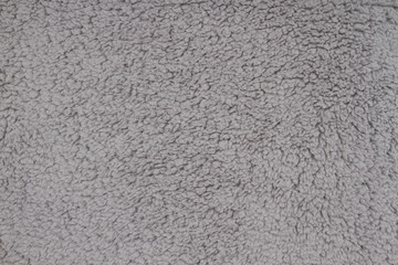 Gray sherpa textured plush fabric material background