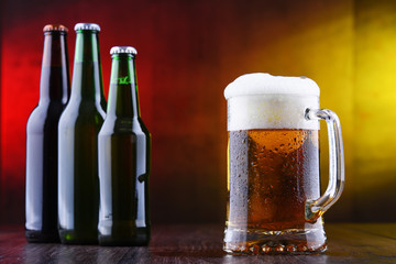 Composition with glass and bottles of beer