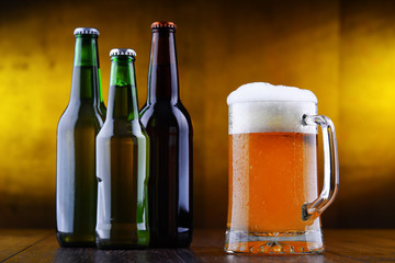 Composition with glass and bottles of beer