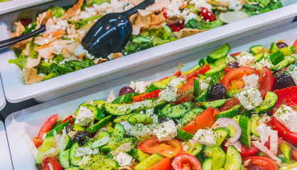 Assortment of fresh vegetable salads in restaurant buffet