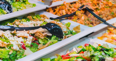 Assortment of fresh vegetable salads in restaurant buffet