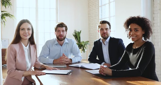 Business executive team looking at camera make conference video call