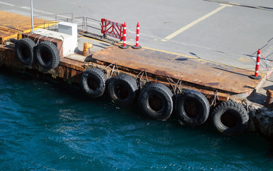 Marine berth protected by old car tires.