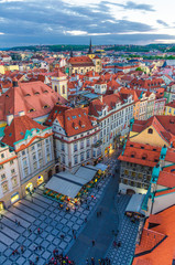 Fototapeta na wymiar Top vertical view of Prague Old Town (Stare Mesto) historical city centre with red tiled roof buildings on Old Town Square (Staromestske namesti) in evening sunset, Bohemia, Czech Republic.