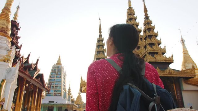 Tourist Girl Walking In Shwedagon Pagoda In Yangon, Myanmar. 4K Slowmotion.