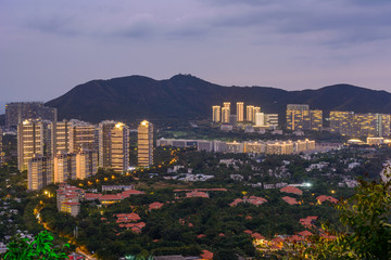 Obraz premium Evening view of Banshan Peninsula (Banshan Bandao), Xiao Donghai Beach from Luhuitou Mountain Park, Sanya, Hainan, China
