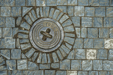 Water manhole on the streets of Prague.