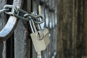 Modern padlock on a historic door.