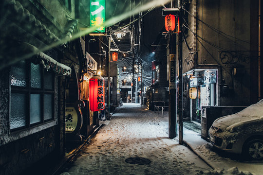 Empty Illuminated Street At Night During Winter