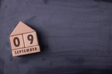September 9 written with wooden blocks