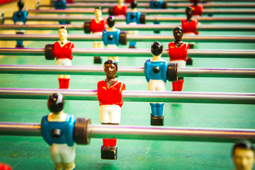 Close up of foosball / table football with players in red and blue.