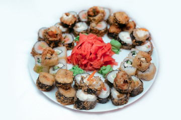 Set of rolls on a white plate. Japanese food. Yum-yum.