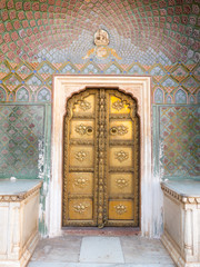 Blue and golden Rose Gate door in City Palace in Jaipur Rajasthan India
