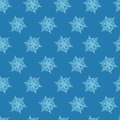 Seamless pattern - real snowflakes on a blue background. The concept of winter, frost, holidays, New Year, Christmas.