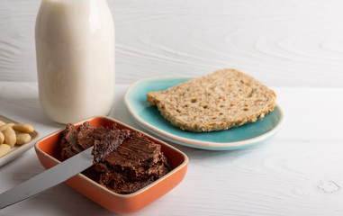 Homemade organic vegan chocolate spread, made of almonds and organic cacao and honey.