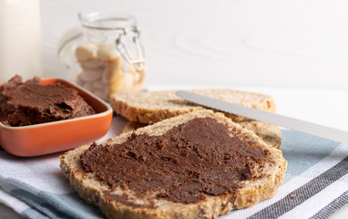 Homemade organic vegan chocolate spread, made of almonds and organic cacao and honey.