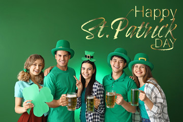 Friends with beer and text HAPPY ST. PATRICK'S DAY on color background