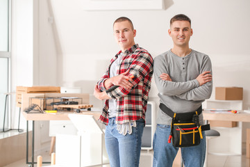 Portrait of furniture assemblers in workshop