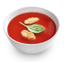 Bowl of tomato soup isolated on a white background