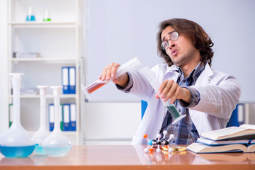 Chemistry lecturer during lecture in college