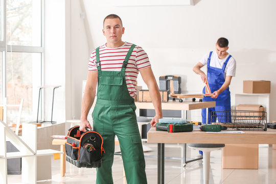 Portrait of furniture assembler in workshop