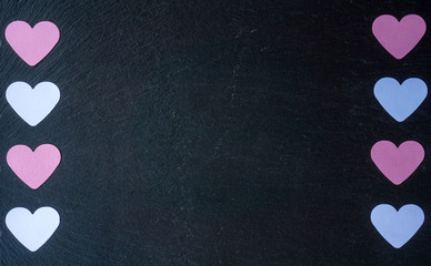 pink and white hearts on a black background