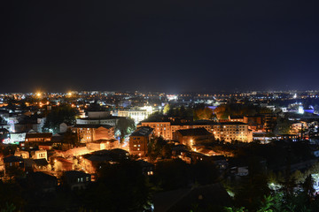 Fototapeta na wymiar Night view to the city from Bagrati Cathedral in Kutaisi, Georgia