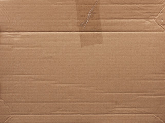 piece of smooth brown cardboard paper, full frame