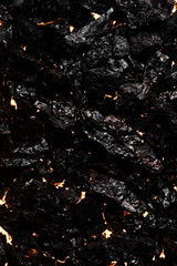 Black charcoal texture, red-hot natural mineral resource background
