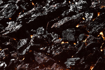 Black charcoal texture, red-hot natural mineral resource background