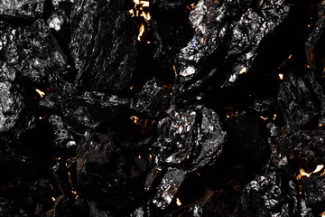 Black charcoal texture, red-hot natural mineral resource background