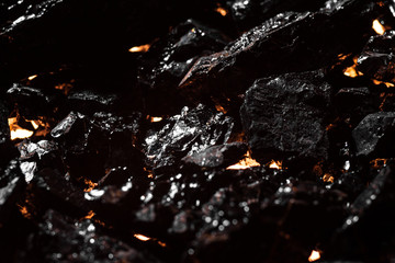 Black charcoal texture, red-hot natural mineral resource background