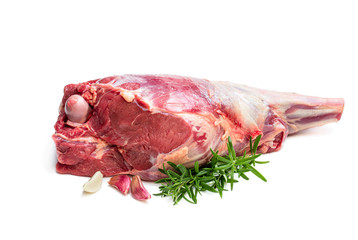 Fresh raw lamb leg with rosemary leaves and garlic isolated on white
