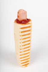 Tasty French hot dog with ketchup. A hot snack sold at gas stations.