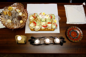 The feast table with food and candles