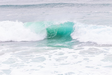Naklejka na ściany i meble Ocean coast, moviment waves with foam.