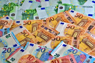 United country's payment system - euro money cash background, pile of paper euro banknotes.	