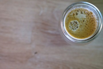 Coffee time in office. Capsule espresso in double glass cup - 100% arabica