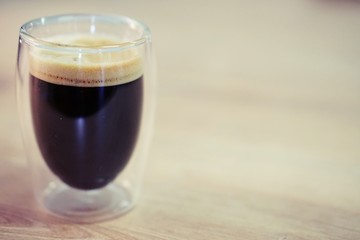 Coffee time in office. Capsule espresso in double glass cup - 100% arabica